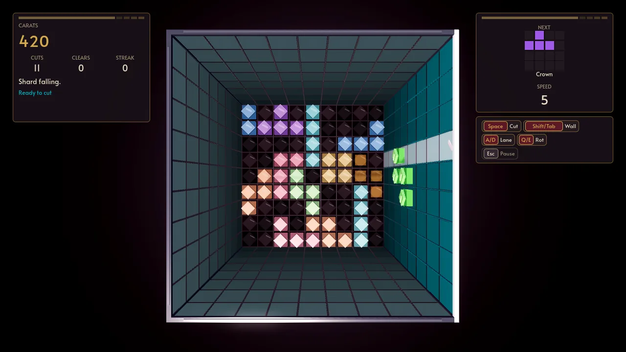 Debrix: a green shard sliding down the east wall of the gem well toward a floor of coloured shards; the HUD reads 420 carats, 11 cuts, speed 5.